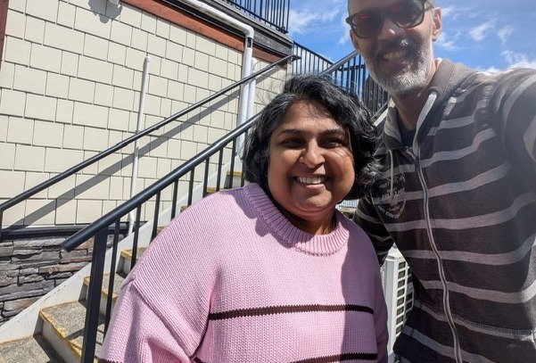 Philippe and Sweta taking a sunny selfie after their coffee
